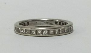 An 18ct white gold, full band diamond eternity ring, finger size N.