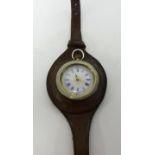 An antique silver fob watch converted to a wristwatch.