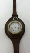 An antique silver fob watch converted to a wristwatch.