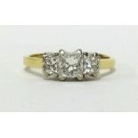 An 18ct three stone princess diamond cut ring, finger size O.