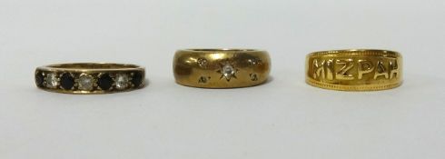 An 18ct Mizpah ring (3.2gms), a sapphire and diamond ring and a diamond set gypsy ring 10.4gms (3).