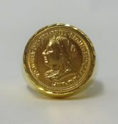 A yellow metal ring set with a gold coin, total weight 22.50gms.