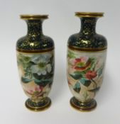 Doulton, pair of vases decorated with flowers and gilt work, height 24cm.