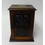 Tobacco carved oak cabinet fitted with a single drawer also jar and pipes.