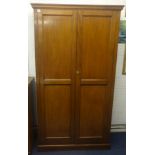 A two door mahogany cupboard with panel doors and sides.