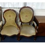 A pair of Victorian mahogany framed chairs comprising gentleman's elbow chair and a ladies nursing