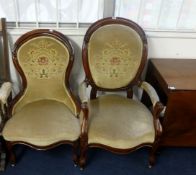 A pair of Victorian mahogany framed chairs comprising gentleman's elbow chair and a ladies nursing