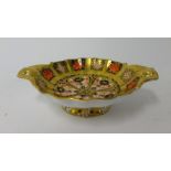 A small Royal Crown Derby porcelain and gilt pattern shallow stem dish.