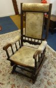 An Edwardian rocking chair.
