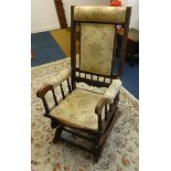 An Edwardian rocking chair.