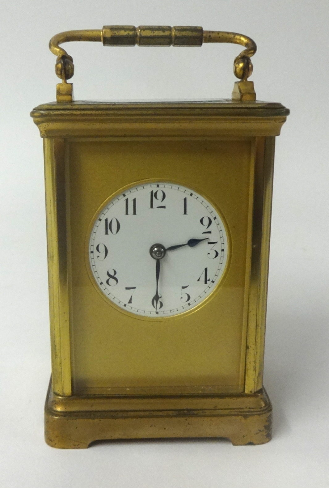 French brass case carriage clock, with gong strike, platform escapement circular dial with arabic