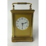 French brass case carriage clock, with gong strike, platform escapement circular dial with arabic