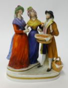 A German porcelain three figure group.