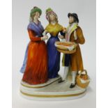 A German porcelain three figure group.