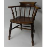 A Victorian elm and beech captains chair.