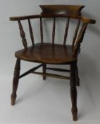 A Victorian elm and beech captains chair.