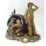 Large 20th century Capo di Monte group modelled as two children in a barrel beside a farmer