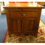 A small modern stained pine unit fitted with sliding drawers and cupboards, approx 70cm wide.