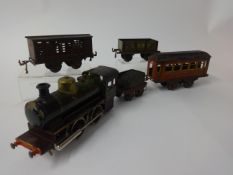 An early 20th century German Bing O gauge 0-4-0 spirit fired locomotive loco and tender, also a