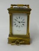 A heavy brass cased carriage clock, with platform escapement, striking on a gong with repeater