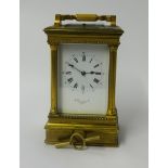 A heavy brass cased carriage clock, with platform escapement, striking on a gong with repeater