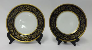 A pair of Bavarian porcelain gilt and blue plates.