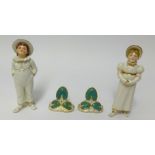 Pair of Royal Worcester porcelain salt and pepper pots formed as young children also a pair of
