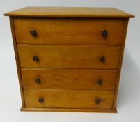 A pine four drawer cabinet, from a Shoe Shop, 'Badminton Original Laces', height 37cm.