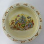 Royal Doulton, Bunnykins cereal bowl decorated with a Christmas scene, 20cm.
