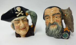 Doulton, two character jugs, Merlin and Long John Silver.