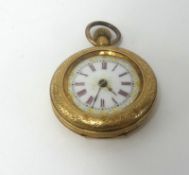 An antique 14ct gold fob watch, with enamel and gilt dial and roman numerals in red.