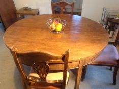 Five Edwardian mahogany carved chairs, (a set of three and two).