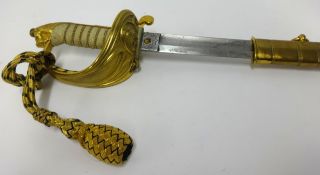 A George V Royal naval officer’s dress sword, the etched blade with foul anchor and G.R.V cypher,