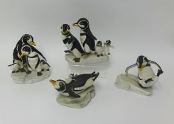 Four Franklin Mint porcelain penguin groups by H.Emblem circa 1980's
