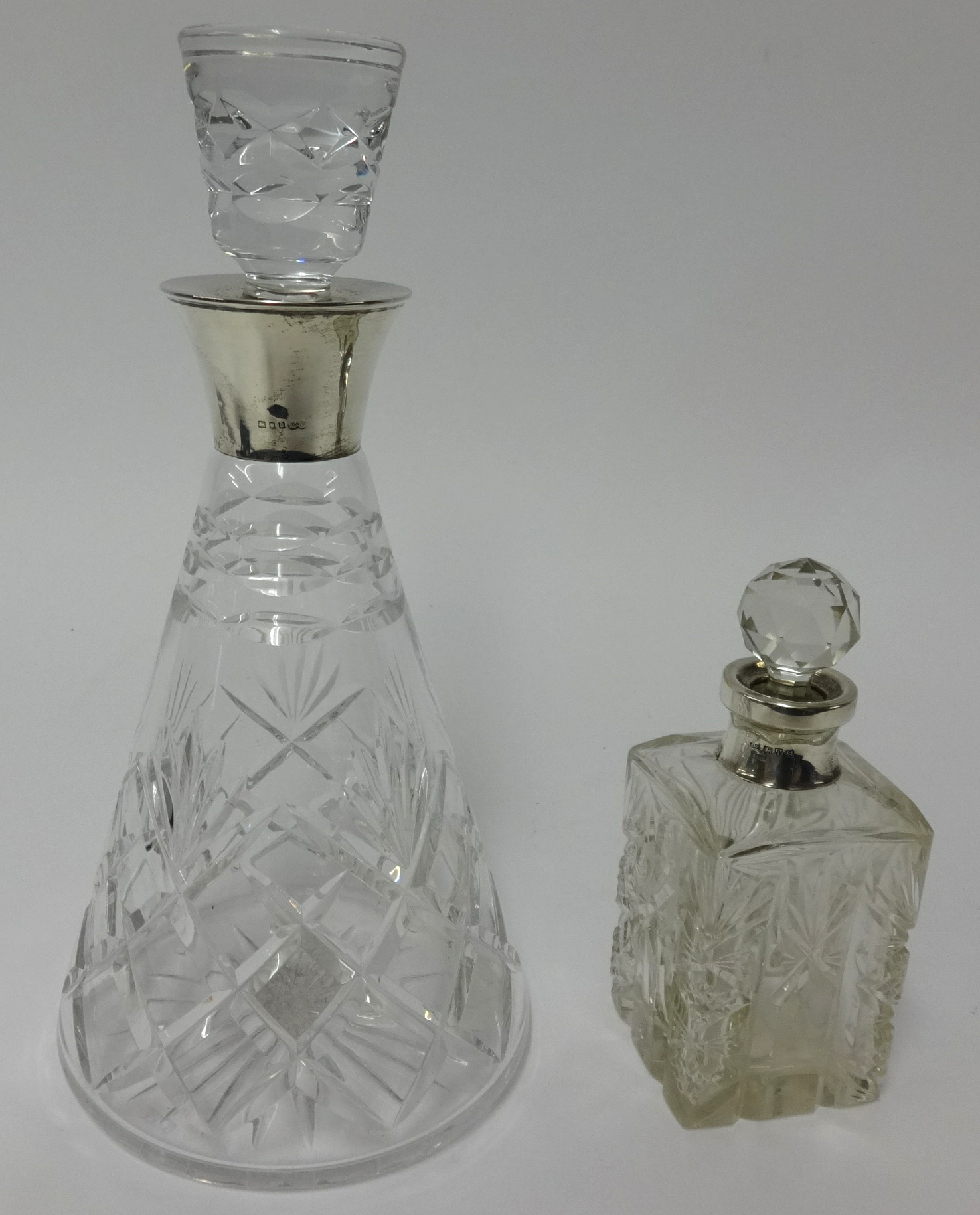 Silver mounted conical shape glass decanter together with a silver mounted scent bottle (2)