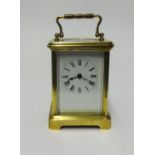 French brass cased carriage clock, fitted keywind, height 17cm handle up, running