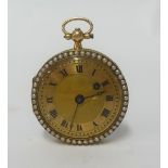 A pretty antique fob watch with gilt dial and roman numerals with key wind hole,