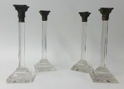 Set four 19th Century, possibly Irish glass candlesticks, each with metal capitals, height 34cm.