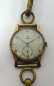 Rolex, a vintage gold cased wristwatch with manual wined movement, subsidiary second dial, running.