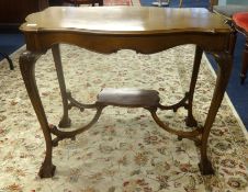 An early 20th century mahogany occasional table with claw ball feet.