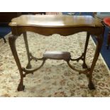 An early 20th century mahogany occasional table with claw ball feet.