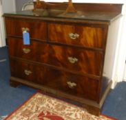A low mahogany chest fitted with two short and two long drawers, with glass cover, width 105cm.