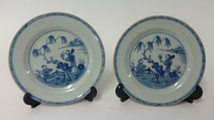 A pair of small 19th Century blue and white Chinese plates, diameter 16cm.