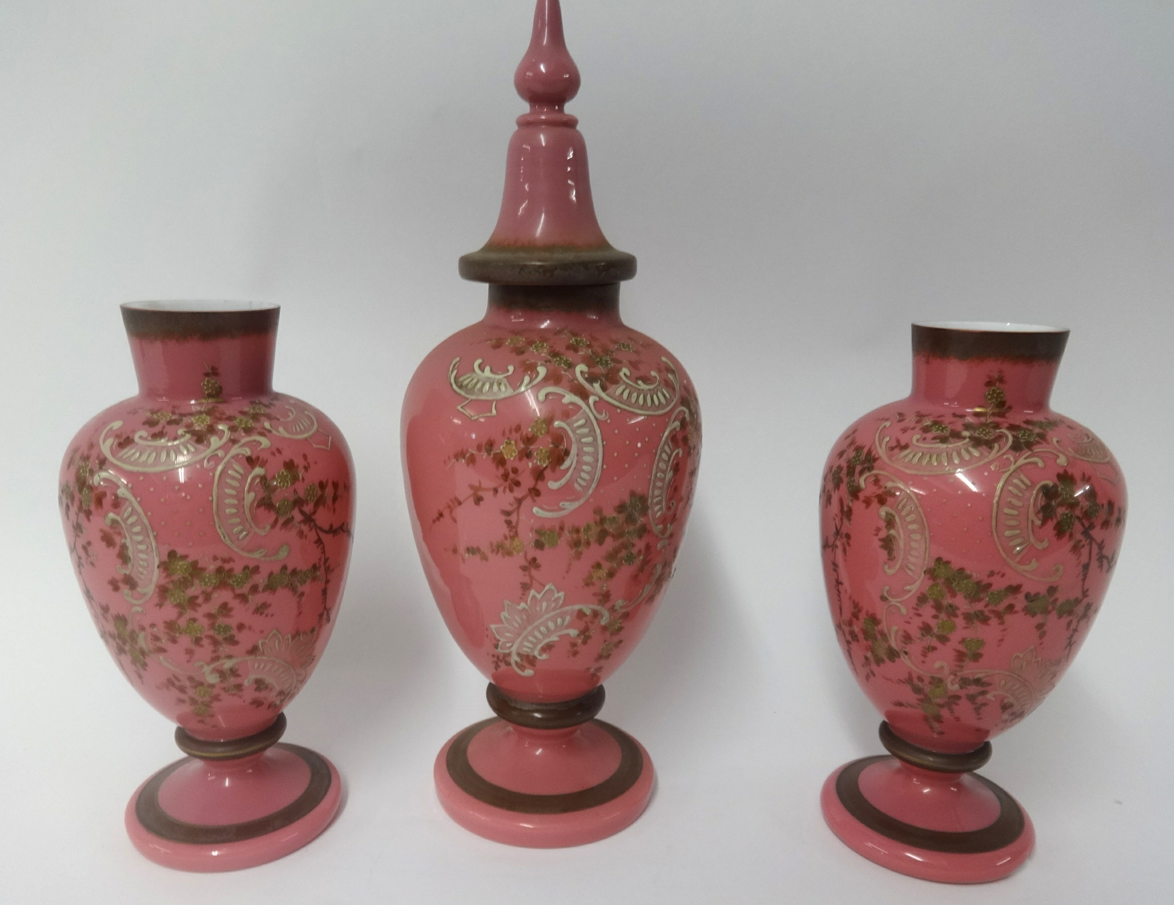 Set of three Victorian pink opaline glass and enamelled vases tallest 44cm approx.