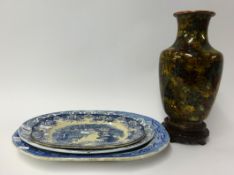 A 20th Century cloisonné enamelled vase on carved wood stand also three blue and white plates.