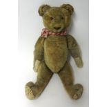 Antique teddy bear, with amber glass eyes (damaged), height 40cm, fur loss, broken growler