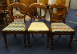 Three Victorian mahogany framed dining chairs.