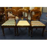 Three Victorian mahogany framed dining chairs.