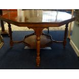 A large Edwardian walnut centre table with lower tier.