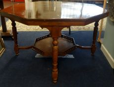 A large Edwardian walnut centre table with lower tier.